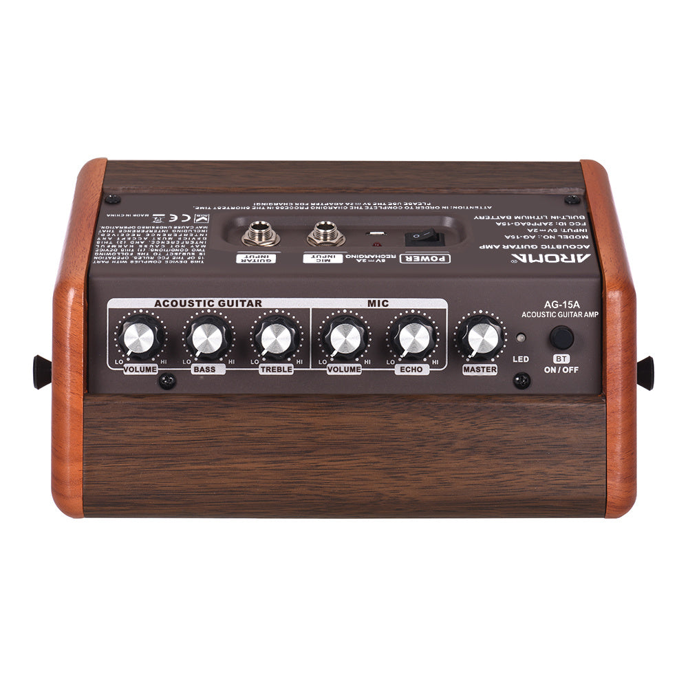 Aroma Acoustic Guitar Charging Speaker features controls for bass, treble, and volume in a sleek, compact design.